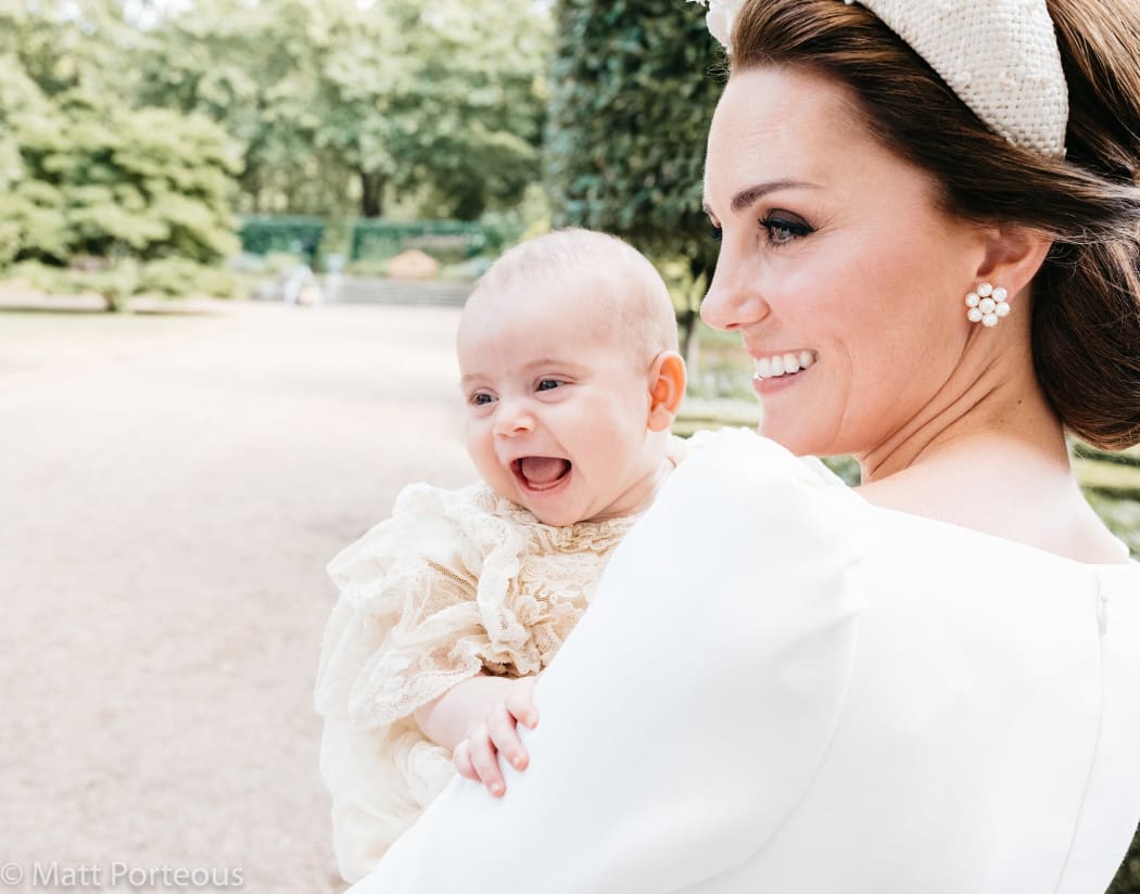 A further picture of the baby prince, alert and with a wide open-mouth smile, was taken by Matt Porteous, chosen by the Duke and Duchess of Cambridge to be their private photographer for the day.