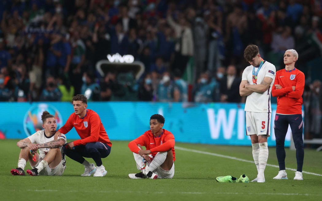 England players look on after Italy won the UEFA EURO 2020 final football match between Italy and England at the Wembley Stadium in London