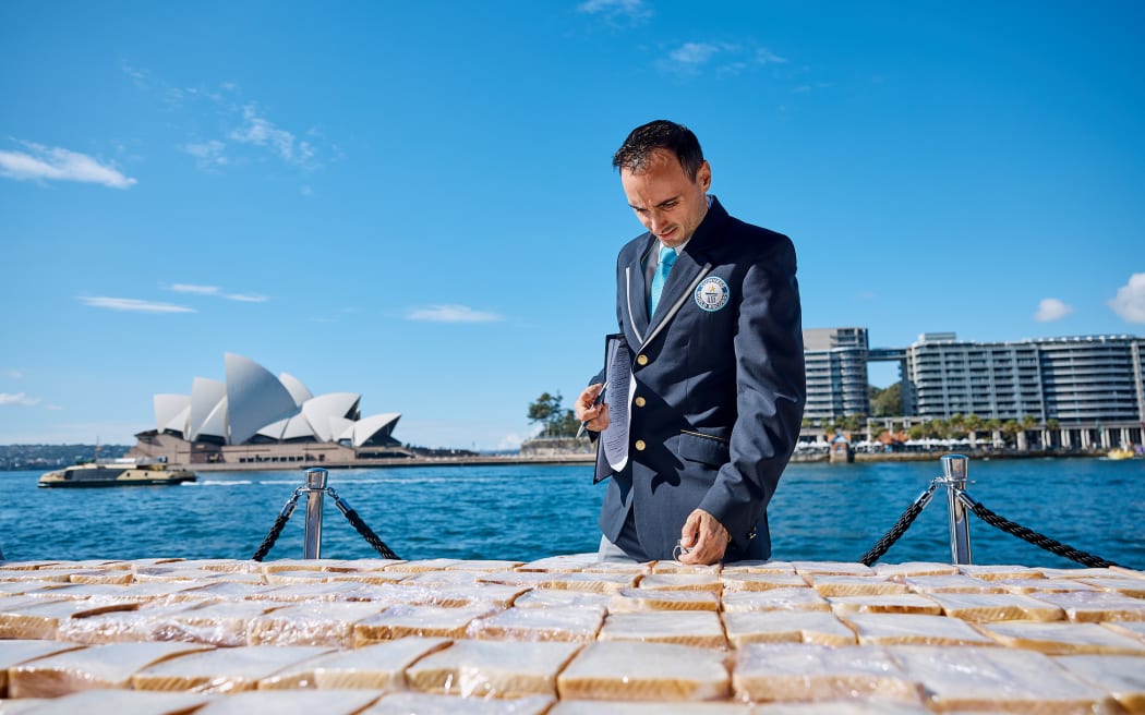 GWR Adjudicator Brian Sobel inspecting the world's longest line of sandwiches
