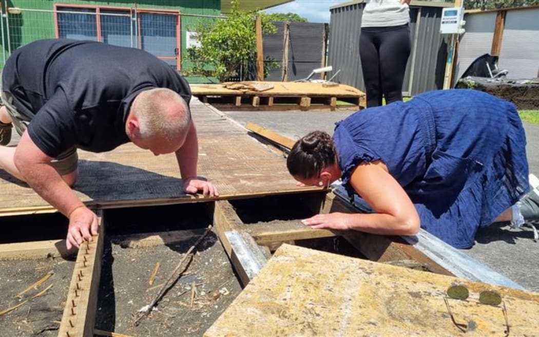 Scott Vile and Anne-Maree McKay search for the kororā chick.