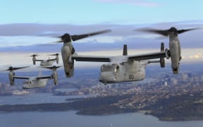 (FILES) This image obtained from the US Marine Corps shows three MV-22B Osprey tiltrotor aircrafts flying in formation above the Pacific Ocean off the coast of Sydney on June 29, 2017. A United States Osprey military aircraft crashed on a remote island north of Australia's mainland while taking part in war games on August 27, 2023, Australia's Defence Department said. (Photo by Amy PHAN / US MARINE CORPS / AFP) / RESTRICTED TO EDITORIAL USE - MANDATORY CREDIT "AFP PHOTO / US MARINE CORPS / Lance Cpl. Amy PHAN" - NO MARKETING NO ADVERTISING CAMPAIGNS - DISTRIBUTED AS A SERVICE TO CLIENTS
