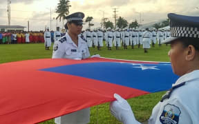 Members of the Samoan Police Force preparing to raise the national flag at Independence Day celebrations in Apia.