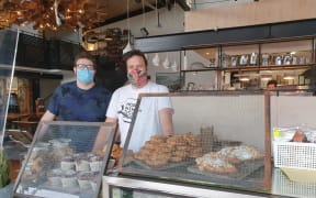 Crave Cafe's James and Nigel Cottle. Nigel Cottle said he was expecting to sell 200 cheese scones today with Auckland in its first day of level 3