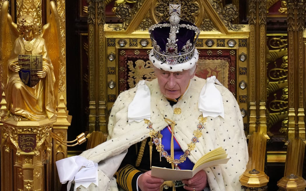 Britain's King Charles III, wearing the Imperial State Crown and the Robe of State, reads the King's speech from The Sovereign's Throne in the House of Lords chamber, during the State Opening of Parliament, at the Houses of Parliament, in London, on November 7, 2023. (Photo by Kirsty Wigglesworth / POOL / AFP)