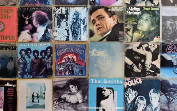 Wall decorated with vintage vinyl records album sleeves.