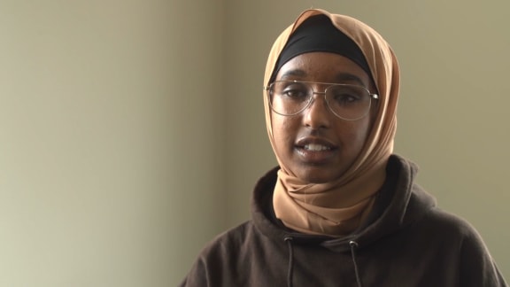 Mulki telling her story in a video from the 'One Year On' website.