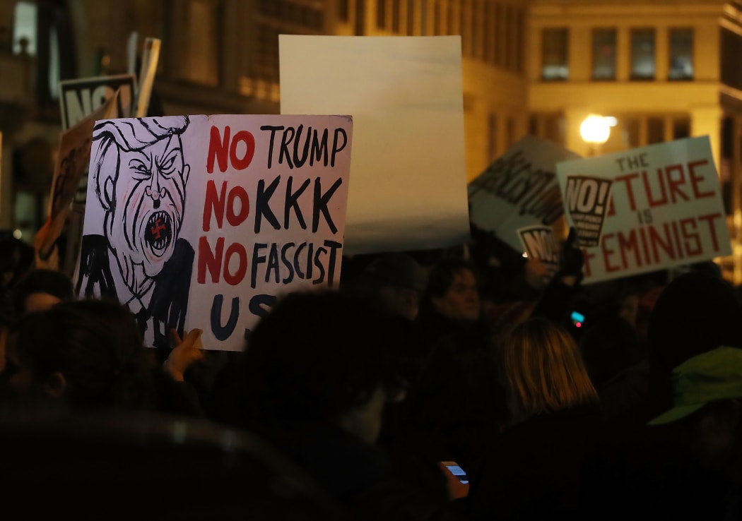 Anti-Trump protesters clash with police outside of the Deplora Ball at the National Press Building on January 19, 2017 in Washington, DC.