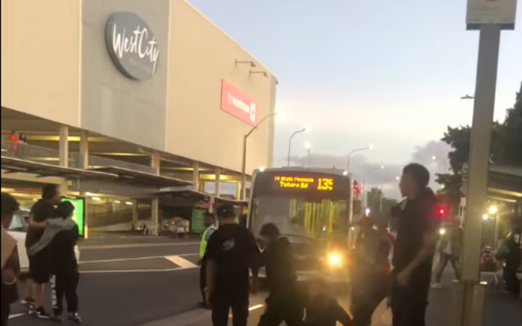 Screenshots taken from a Facebook video. Some faces have been blurred.