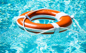 Drowning in water catch lifebuoy. Safety and urgent help. Resque needed. Life buoy floating in pool