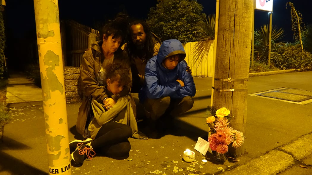 Malik Ricks (Dad), Suki Hickling (Mum) Frida Ricks (daughter) and Tahi Ricks who laid flowers and lit candles at cordon by Linwood mosque this evening - March 15 2019