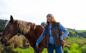Pakiri Beach Horse Rides owner Sharley Haddon with one of her horses.