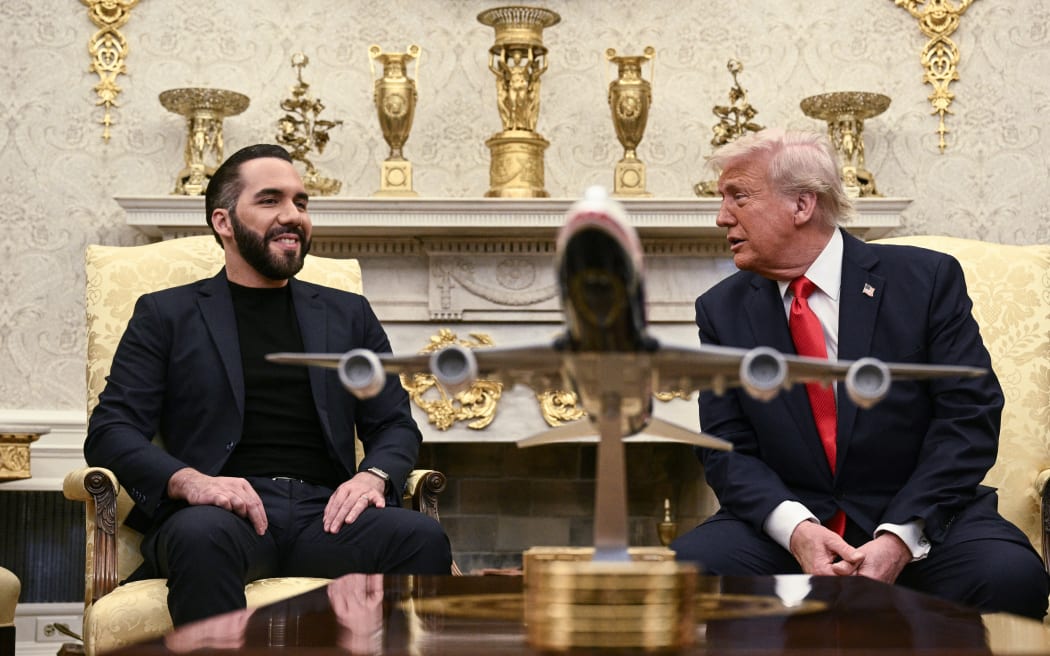 US President Donald Trump meets with El Salvador's President Nayib Bukele in the Oval Office of the White House in Washington, DC, April 14, 2025. Trump on Monday hosted El Salvador's President Nayib Bukele, the self-described "world's coolest dictator" who is now the US leader's key ally in a controversial push to deport illegal migrants to a notorious Salvadoran prison. The meeting comes as the White House faces pressure over the case of a father who was mistakenly deported to the jail in the Central American country -- whose return a US court has ordered the Trump adminstration to facilitate (Photo by Brendan SMIALOWSKI / AFP)