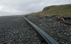 The 100m-long pipe that washed up on the Southland beach.