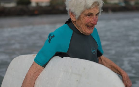 92-year-old surfer Nancy Meherne heads out to catch some waves