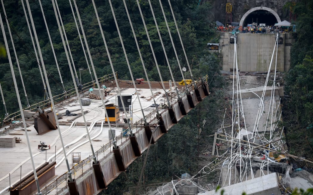 At least nine workers were killed when the bridge suddenly gave way.