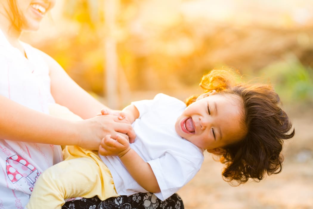 happy kid with mother