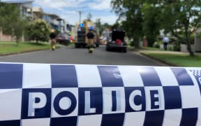 The police cordon at the scene where the car was set on fire in Brisbane.