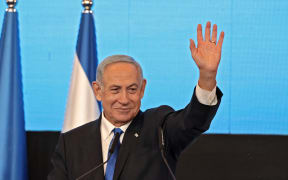 The leader of Israel's Likud party, Benjamin Netanyahu, addresses supporters at campaign headquarters in Jerusalem shortly after the end of voting in the country's 2022 national elections.