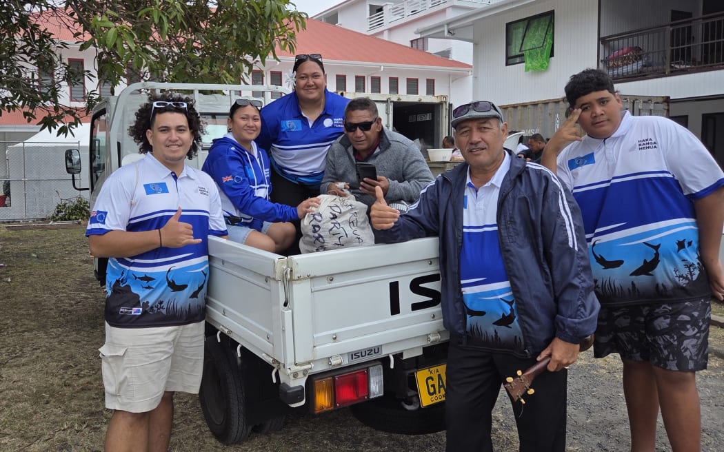 Penrhyn loads up the tray of the truck full of food to donate to the other groups from the Outer Islands.