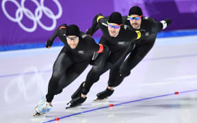 Front to back: New Zealand's Reyon Kay, New Zealand's Peter Michael, and New Zealand's Shane Dobbin compete in the men's team pursuit quarter-final speed skating event during the Pyeongchang 2018 Winter Olympic Games.