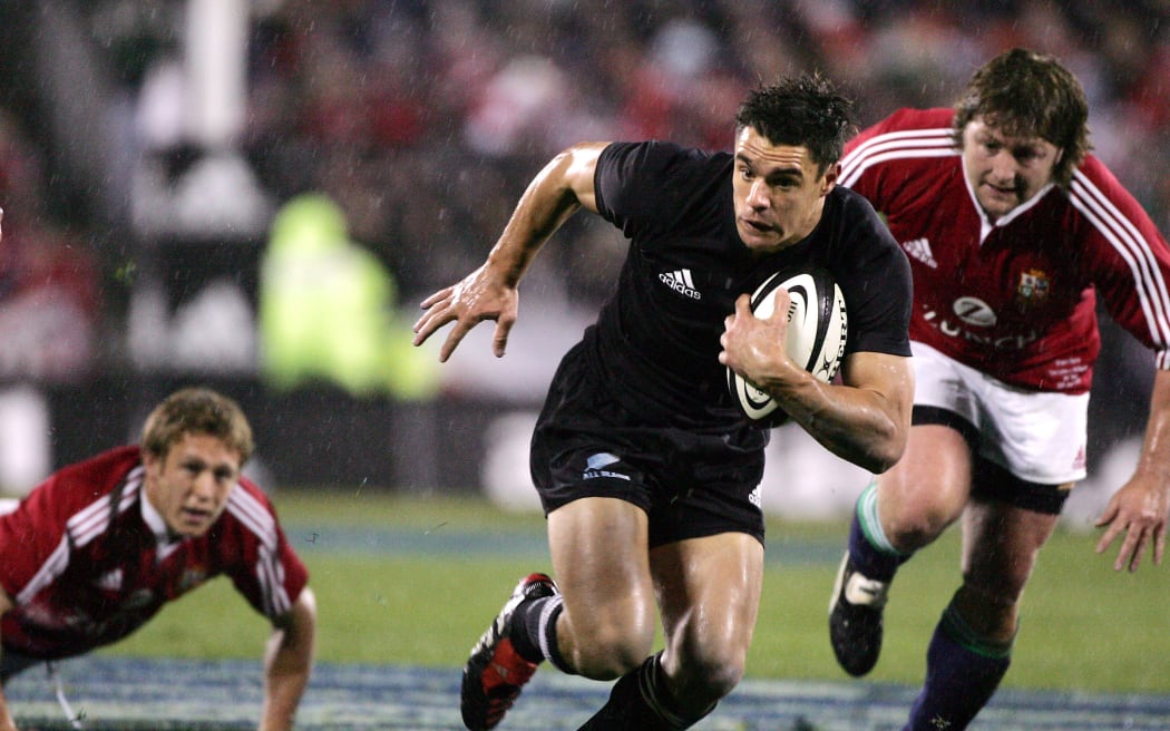 All Black Dan Carter slips the tackle of Jonny Wilkinson during the 1st test match between the New Zealand All Blacks and the British and Irish Lions at Jade Stadium in Christchurch,New Zealand in June, 2005. The All Blacks won 21-3.