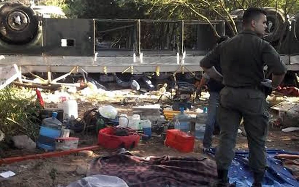 Gendarmerie members at the scene where a bus drove off a bridge in the Salta province, north of Argentina.