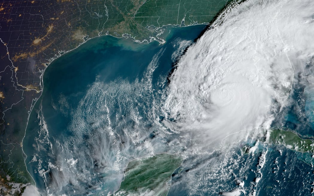This satellite images courtesy of the National Oceanic and Atmospheric Administration (NOAA) and the Regional and Mesoscale Meteorology Branch (RAMMB) taken on October 9, 2024, shows the formation of Hurricane Milton over the Gulf of Mexico. - Hurricane Milton exploded in strength October 7 to become a potentially catastrophic Category 5 storm bound for Florida, threatening the US state with a second ferocious hurricane in as many weeks. (Photo by HANDOUT / NOAA / AFP) / RESTRICTED TO EDITORIAL USE - MANDATORY CREDIT "AFP PHOTO / NOAA / RAMMB" - NO MARKETING NO ADVERTISING CAMPAIGNS - DISTRIBUTED AS A SERVICE TO CLIENTS