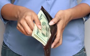 Person holding wallet