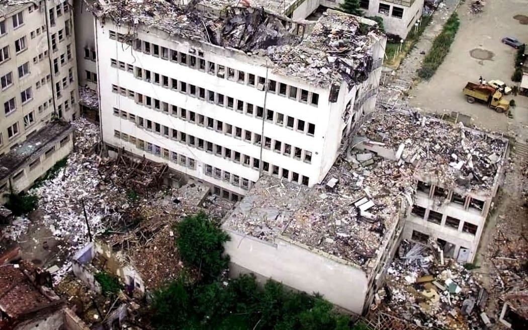 Aerial view taken 15 June 1999 shows Pristina's central post office destroyed by NATO bombing. Serb forces pursued their pullout from southern Kosovo on Tuesday hours before the midnight deadline. (Photo by POOL / AFP)
