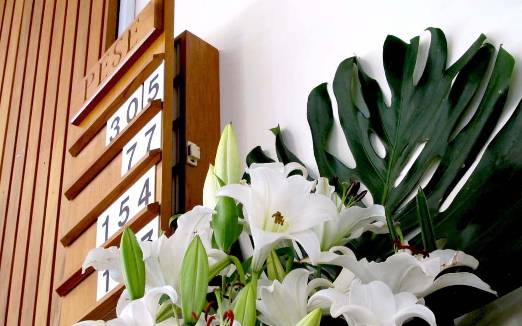 flowers and hymn board