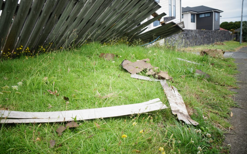 The roof of an unoccupied home in the Auckland suburb of Hillsborough came off in high winds and scattered debris down the road.