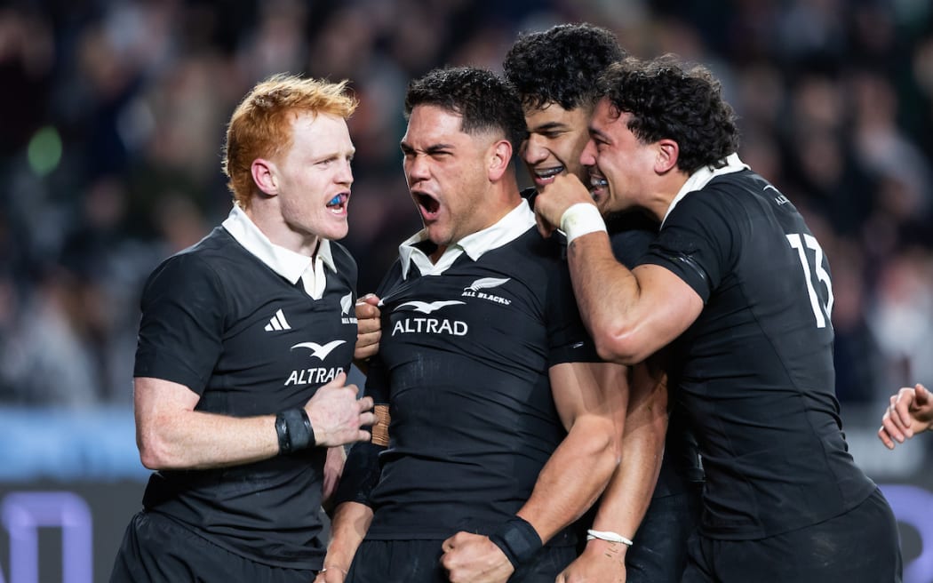 Quinn Tupaea celebrates.