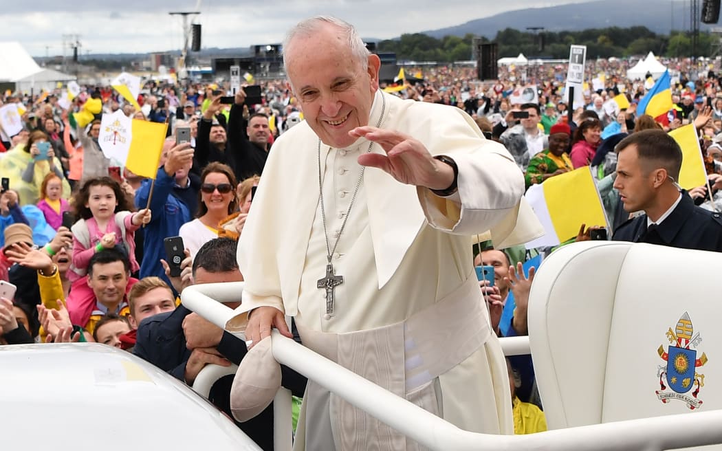 Pope Francis waves to the faithfull as he arrives to lead the Holy Mass at Phoenix Park in Dublin.