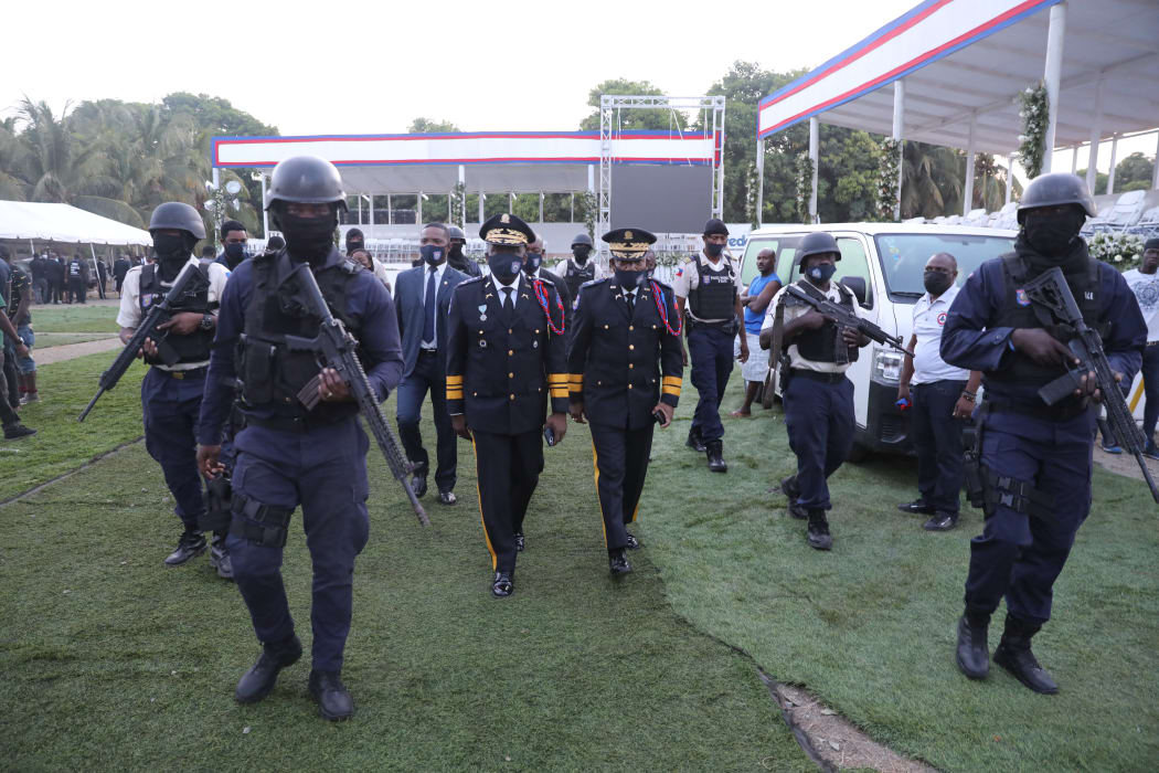 Haitian National Police chief Léon Charles (center left) arrives for the funeral of the slain Haitian President Jovenel Moïse.