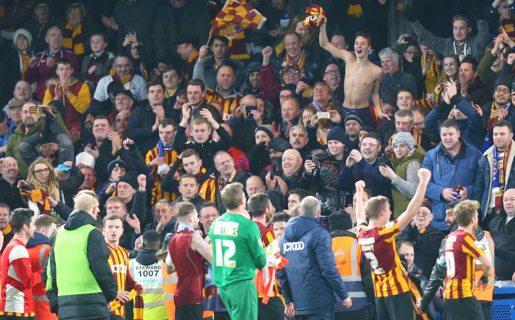 Bradford City players celebrate with their fans.