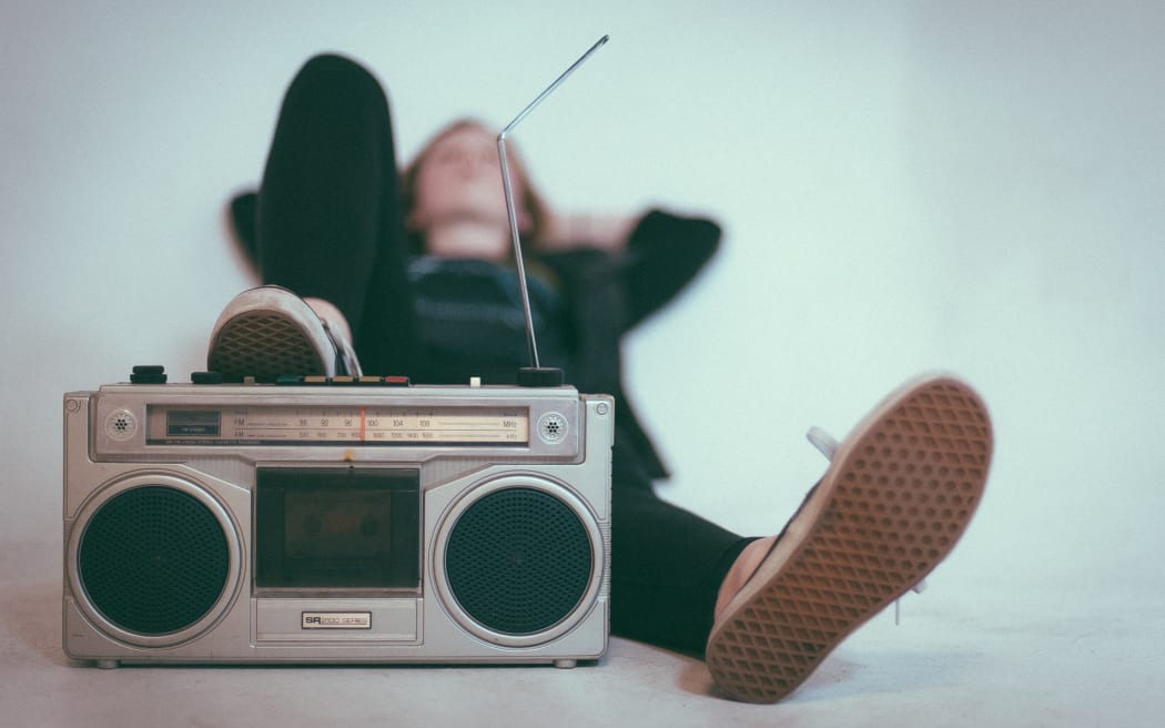 A typical photo of a person relaxing while listening to the radio