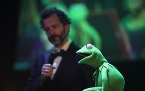 Bret McKenzie and Kermit onstage at The Jim Henson Retrospectacle
