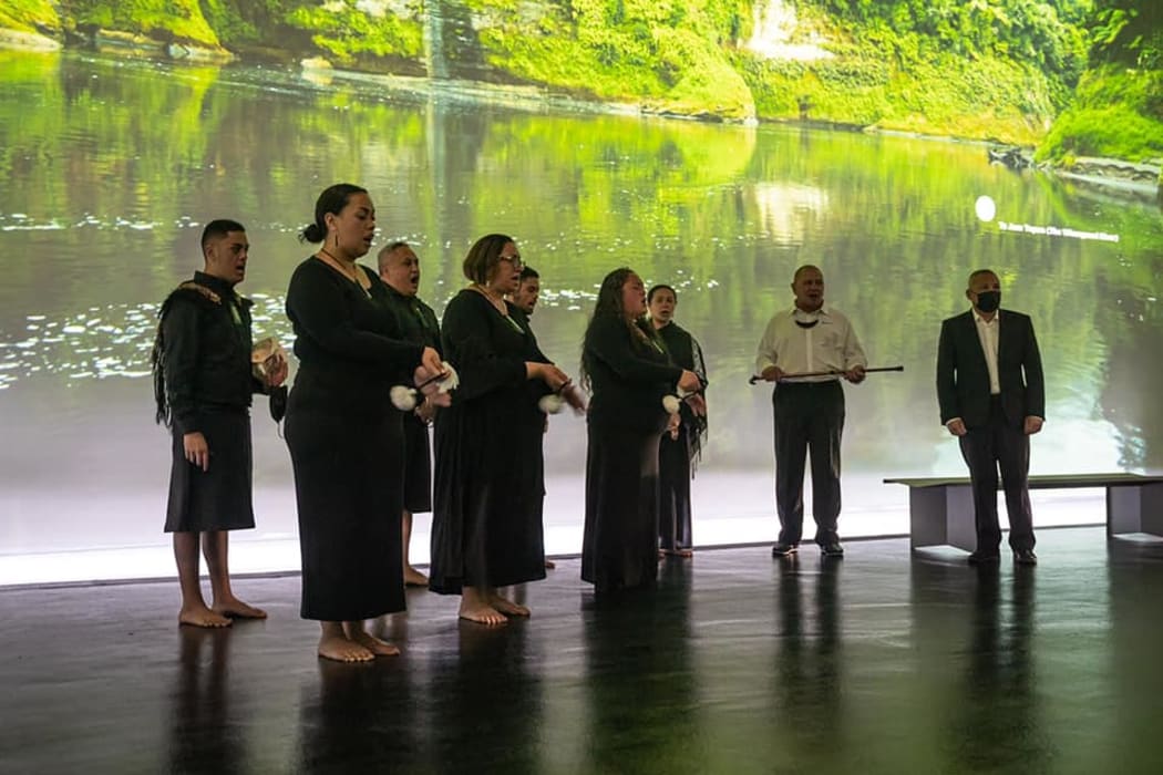 Whanganui River iwi members perform the tāngaengae ritual at dawn in the New Zealand Pavilion in Dubai.