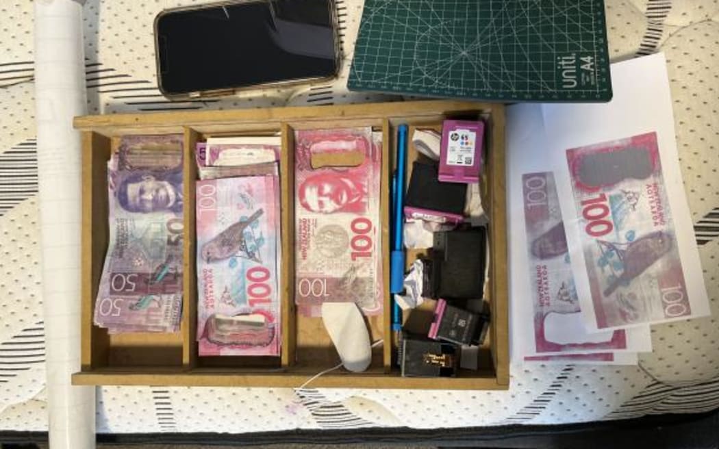 The counterfeit cash found by police.