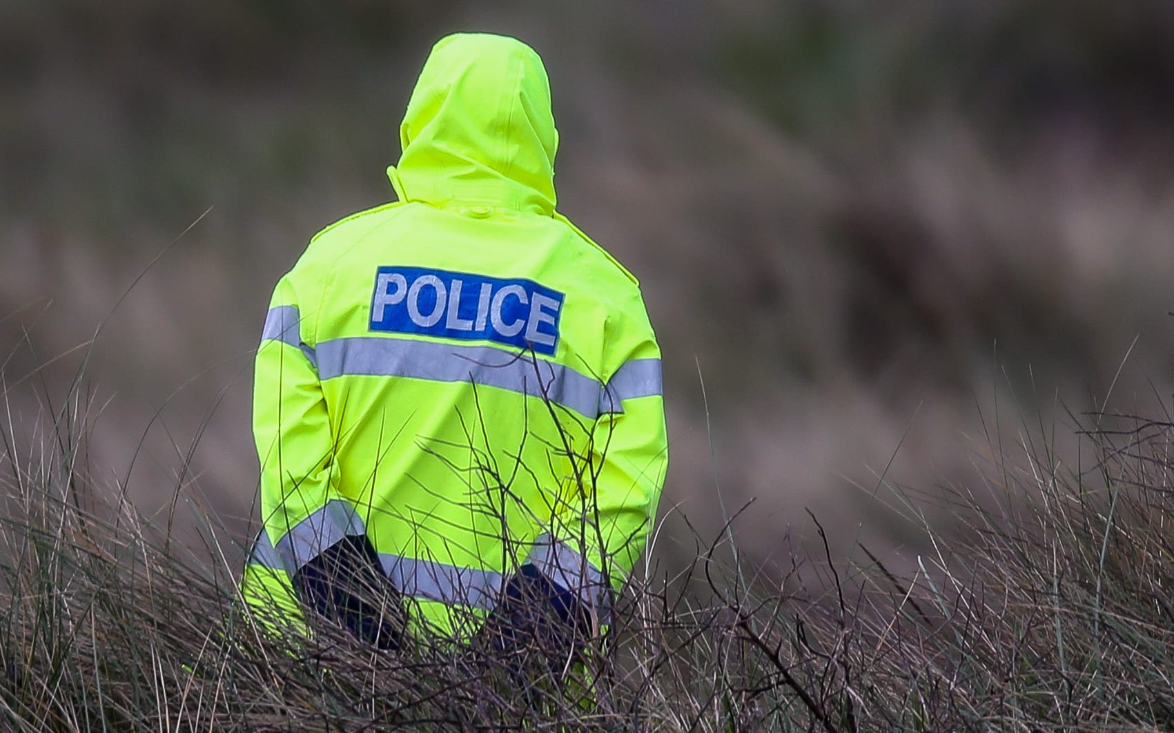 Police officer at the cordon of Alex Fisher.