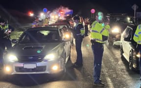 Police check cars as part of Operation Cartel, June 2024.