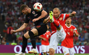 Croatia's forward Ante Rebic (L) vies for the ball with Russia's defender Fyodor Kudryashov during the Russia 2018 World Cup quarter-final football match.