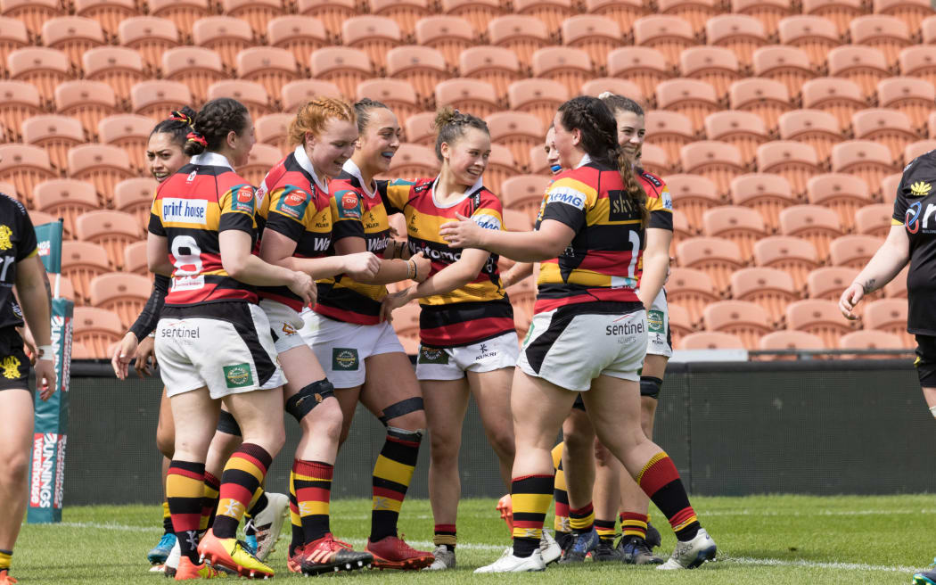Waikato's Kelsey Teneti is congratulated by team mates.