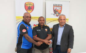 PNG Referees Director, Joe Peregua, referee Paul Wani and PNGRFL CEO Reatau Rau.