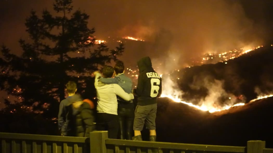 Residents watch the fires burn along Worsleys Road and Cracroft, from Dyers Pass Road.
