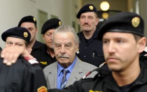 RESTRICTED TO EDITORIAL USE
Defendant Josef Fritzl (C) arrives at court on trial for incest and murder on March 19, 2009 in the provincial courthouse in Sankt Poelten. Josef Fritzl told the court he was "sorry" today as the jury in his incest and murder trial withdrew to consider its verdict, which could land him behind bars for life.
AFP PHOTO/POOL/HELMUT FOHRINGER
== These photographs are being licensed free of charge for editorial use by media representatives covering the ongoing criminal trial. All other uses, including resale of the photographs, are strictly prohibited. The user takes sole responsibility for protecting the image and identity rights of those pictured, by pixellation or other means. (Photo by Helmut Fohringer / POOL / AFP)