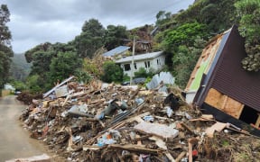 Slips, house damage in Karekare in West Auckland caused by Cyclone Gabrielle