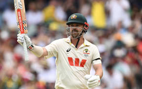 Travis Head of Australia celebrates scoring a half century during Day 3 of the Third Men’s Ashes Test between Australia and England at the Adelaide Oval.