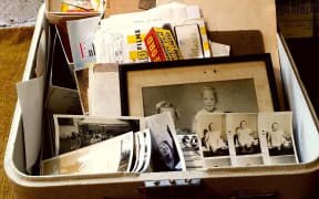 A trove of family photos was discovered in a sewing machine box dropped off at an Auckland community recycling centre.