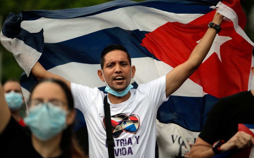 Cuban residents in Panama protest against the Cuban government near the Cuban Embassy in Panama City.